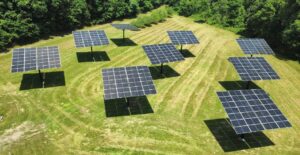 Field of pole-mounted dual-axis solar trackers at a Christian retreat center