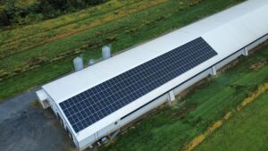 Overhead view of rooftop solar on a long farm barn near Schuylkill Haven, PA